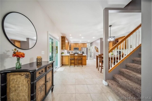 interior space with recessed lighting, stairs, and light tile patterned flooring