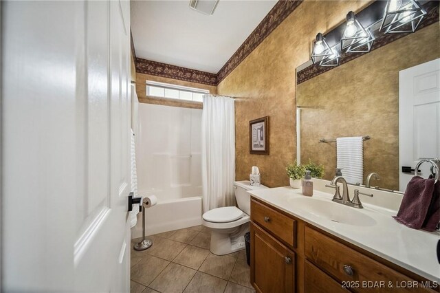 bathroom featuring vanity, toilet, tile patterned floors, shower / bath combo with shower curtain, and visible vents