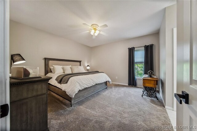carpeted bedroom with baseboards and a ceiling fan