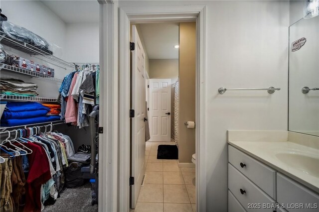 interior space with a sink and light tile patterned floors