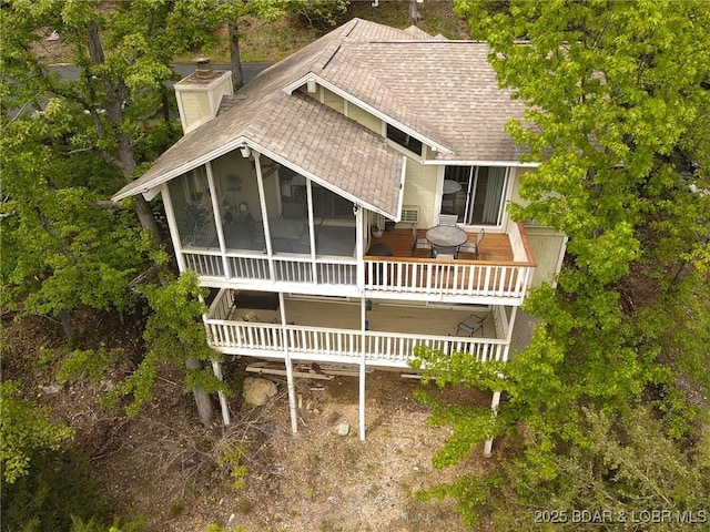 362 Hopetown Dr, Osage Beach, MO 65065 - back of house featuring a deck, a shingled roof, a sunroom, and a chimney