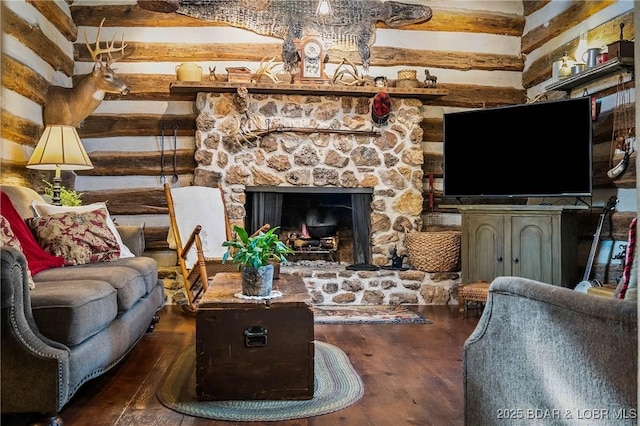 129 Vaughan Rd, Eldon, MO 65026 - living area featuring wood finished floors and a stone fireplace