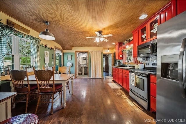 129 Vaughan Rd, Eldon, MO 65026 - kitchen with stainless steel appliances, dark brown cabinets, wood ceiling, dark wood finished floors, and dark countertops