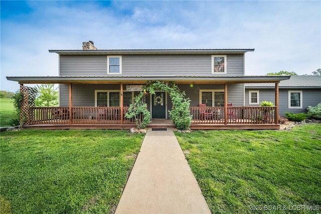 129 Vaughan Rd, Eldon, MO 65026 - farmhouse with a chimney, a front lawn, and a wooden deck