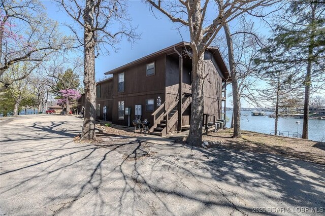 256 Lone Oak Pt Unit 15, Sunrise Beach, MO 65079 - back of property featuring stairway and a water view