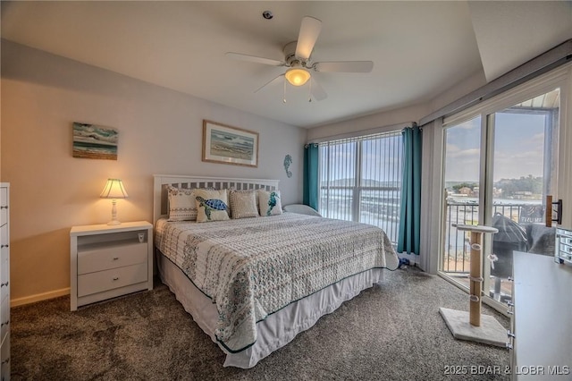 bedroom featuring baseboards, access to exterior, ceiling fan, and dark colored carpet