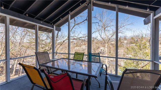 sunroom with outdoor dining space
