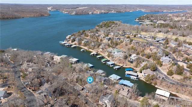 bird's eye view featuring a water view and a residential view