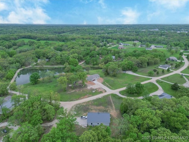 21 Meadow Lake Cir, Eldon, MO 65026 - aerial overview of property's location featuring a heavily wooded area and a large body of water