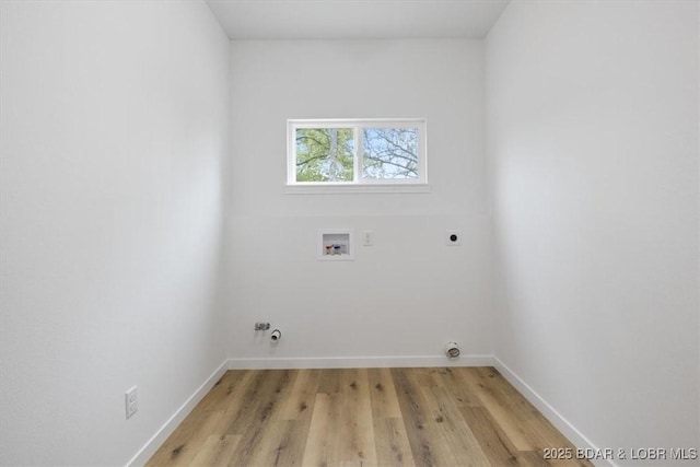 21 Meadow Lake Cir, Eldon, MO 65026 - laundry room featuring hookup for an electric dryer, washer hookup, light wood-style flooring, and baseboards