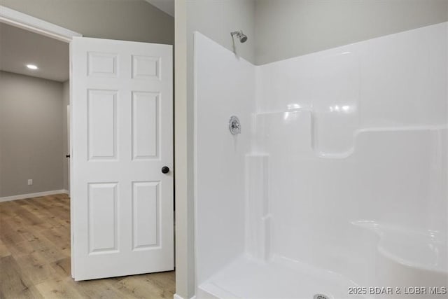 21 Meadow Lake Cir, Eldon, MO 65026 - bathroom with a shower, wood finished floors, and baseboards