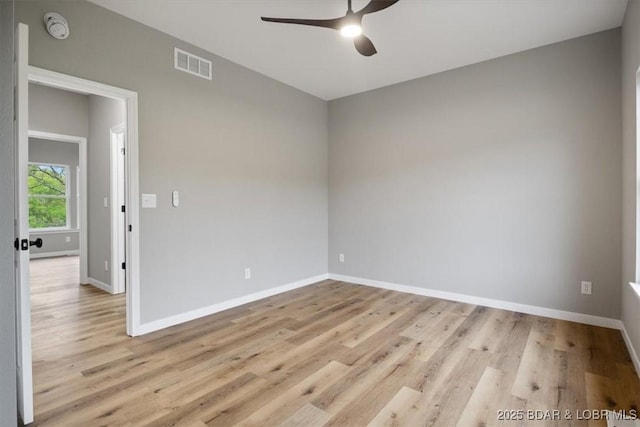 21 Meadow Lake Cir, Eldon, MO 65026 - empty room with ceiling fan, baseboards, light wood-style floors, and a smoke detector