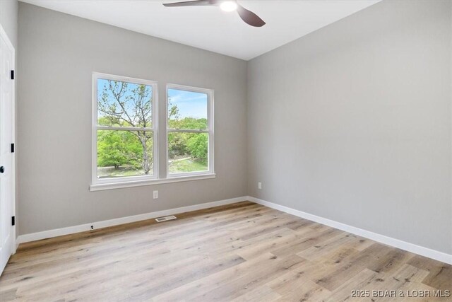 21 Meadow Lake Cir, Eldon, MO 65026 - spare room with ceiling fan, light wood finished floors, and baseboards