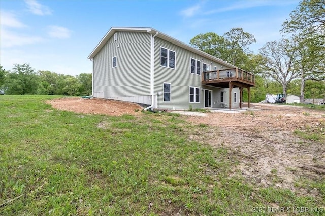 21 Meadow Lake Cir, Eldon, MO 65026 - rear view of property featuring a wooden deck and a lawn