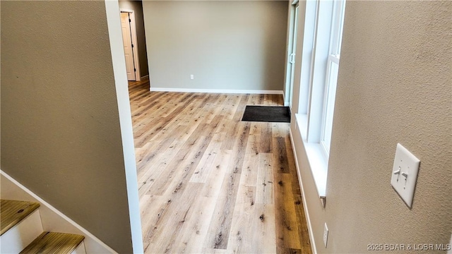 21 Meadow Lake Cir, Eldon, MO 65026 - hallway featuring wood finished floors, a textured wall, and baseboards