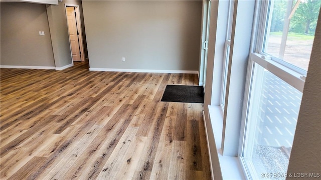 21 Meadow Lake Cir, Eldon, MO 65026 - empty room featuring wood finished floors and baseboards