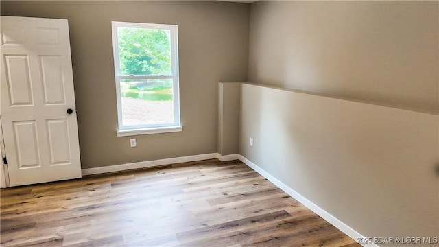 21 Meadow Lake Cir, Eldon, MO 65026 - spare room featuring light wood finished floors and baseboards