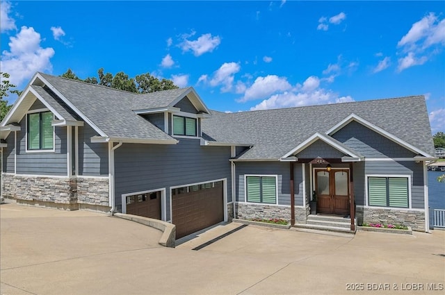 1484 Apple Blossom Cir, Osage Beach, MO 65065 - craftsman-style home with stone siding, driveway, roof with shingles, and a garage