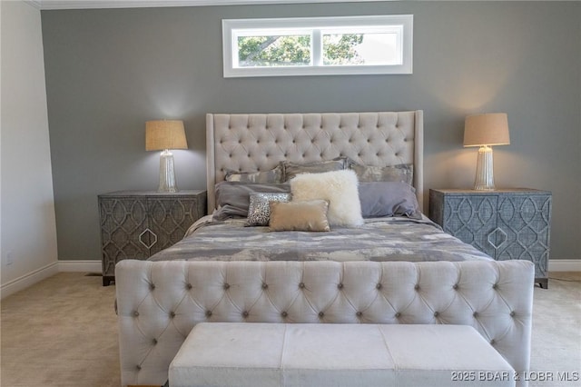 bedroom featuring baseboards and carpet