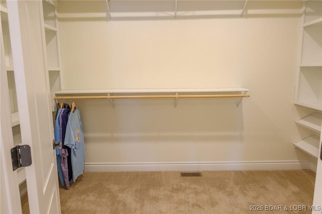 walk in closet with carpet and visible vents