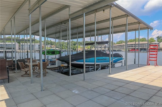 view of dock with boat lift and a water view