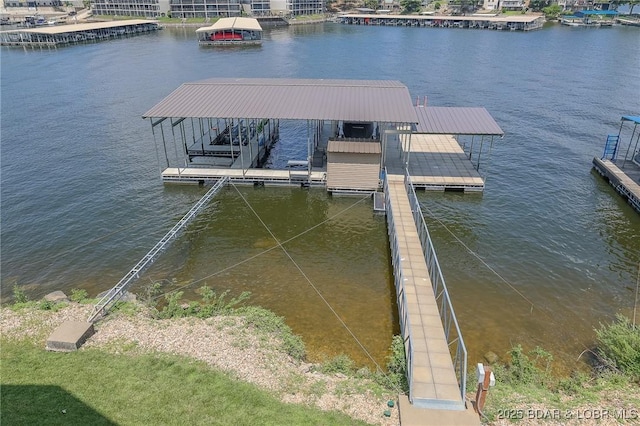 dock area featuring a water view and boat lift
