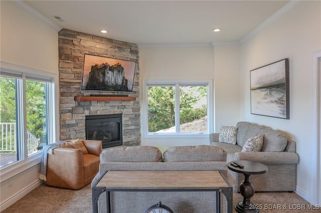 living area with crown molding, carpet flooring, and a wealth of natural light