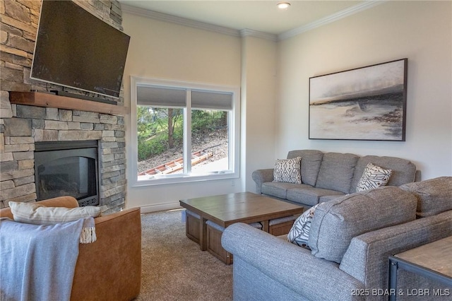 carpeted living room featuring crown molding and a fireplace