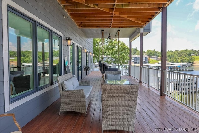 wooden deck with a water view