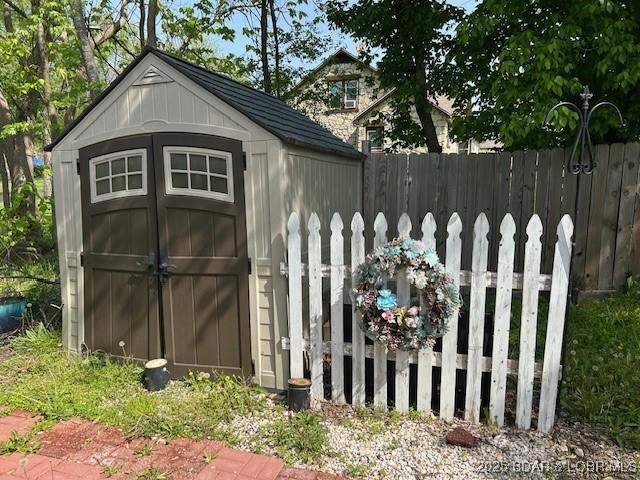 view of shed with fence