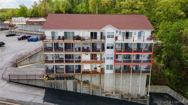 768 Clearwater Dr Unit 2-A, Camdenton, MO 65020 - view of apartment building / complex with a forest view and uncovered parking
