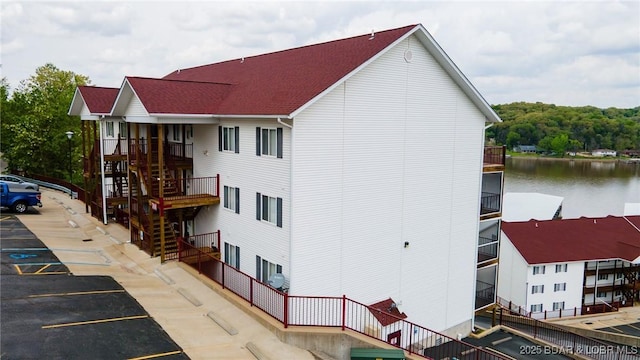 768 Clearwater Dr Unit 2-A, Camdenton, MO 65020 - view of property featuring uncovered parking, stairway, and a water view