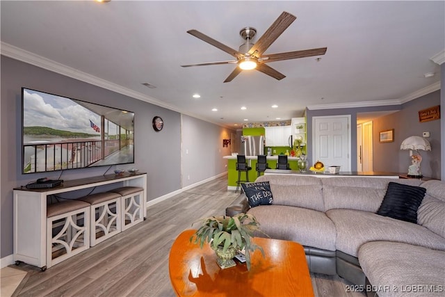 768 Clearwater Dr Unit 2-A, Camdenton, MO 65020 - living room with ornamental molding, ceiling fan, light wood-style flooring, and recessed lighting