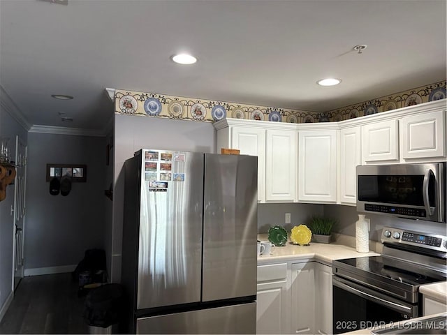 768 Clearwater Dr Unit 2-A, Camdenton, MO 65020 - kitchen with stainless steel appliances, light countertops, white cabinets, recessed lighting, and ornamental molding
