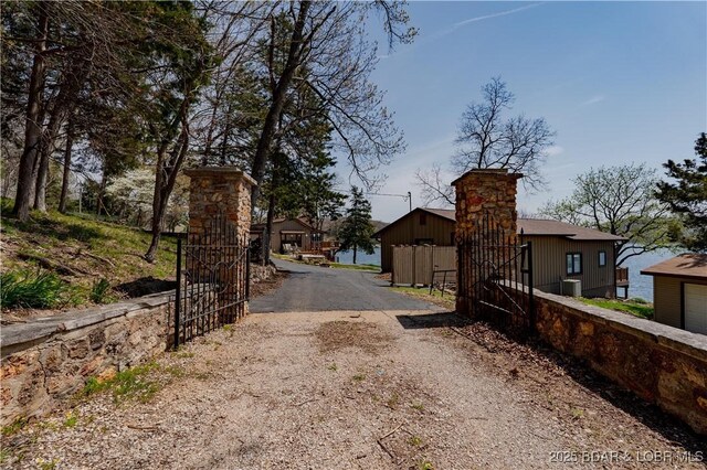 29540 Inspiration Pt, Rocky Mount, MO 65072 - view of road featuring a gated entry and driveway