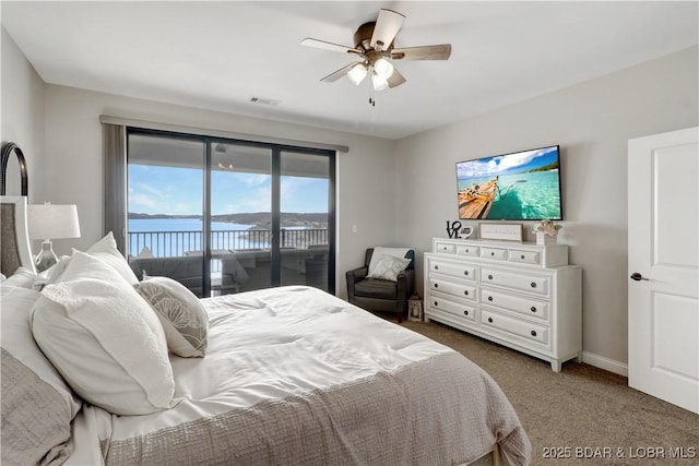 166 Captiva Dr Unit 5B, Sunrise Beach, MO 65079 - carpeted bedroom with baseboards, visible vents, a ceiling fan, and access to exterior