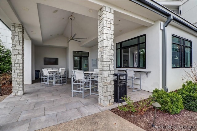166 Captiva Dr Unit 5B, Sunrise Beach, MO 65079 - view of patio featuring ceiling fan and outdoor dining area