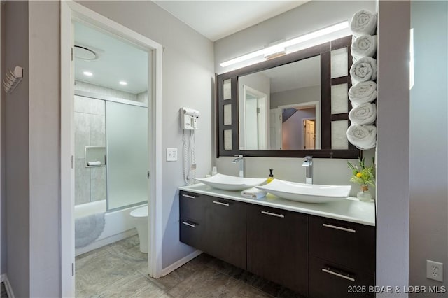 56 Treasure Cay, Osage Beach, MO 65065 - full bathroom with double vanity, bath / shower combo with glass door, and toilet