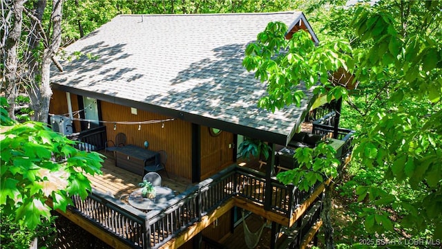 56 Treasure Cay, Osage Beach, MO 65065 - back of property featuring roof with shingles, stairs, and a wooden deck