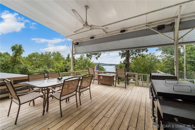 18 Trail Rd, Eldon, MO 65026 - wooden terrace with a water view, ceiling fan, and outdoor dining space