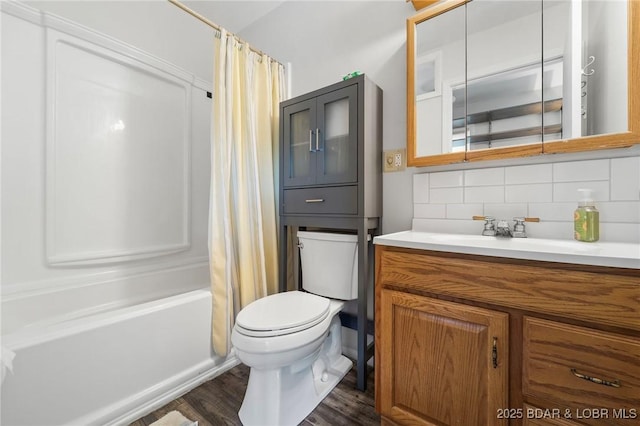 18 Trail Rd, Eldon, MO 65026 - bathroom with vanity, wood finished floors, shower / bath combination with curtain, toilet, and backsplash