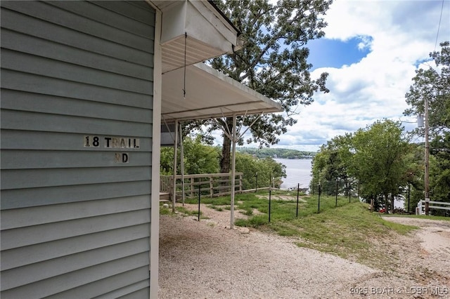 18 Trail Rd, Eldon, MO 65026 - exterior space with a water view, fence, and dirt driveway