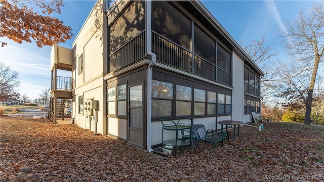 67 Ventura Dr Unit 427, Lake Ozark, MO 65049 - view of side of property featuring a balcony and a sunroom