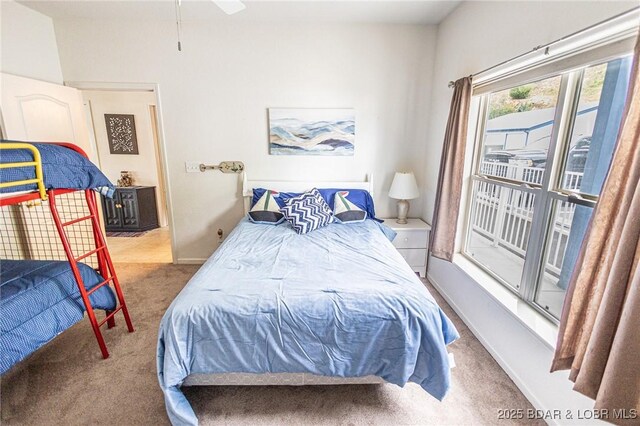 bedroom with carpet flooring and baseboards