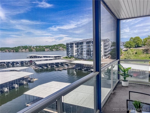 exterior space with a water view and a balcony