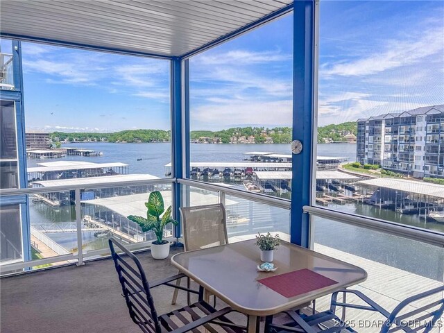 sunroom with a water view