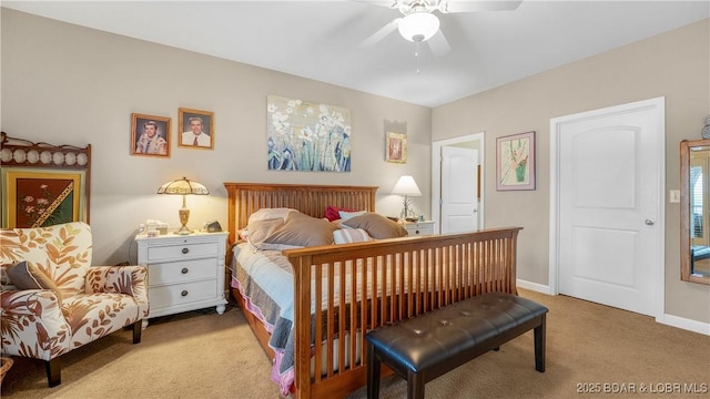 carpeted bedroom featuring baseboards and ceiling fan