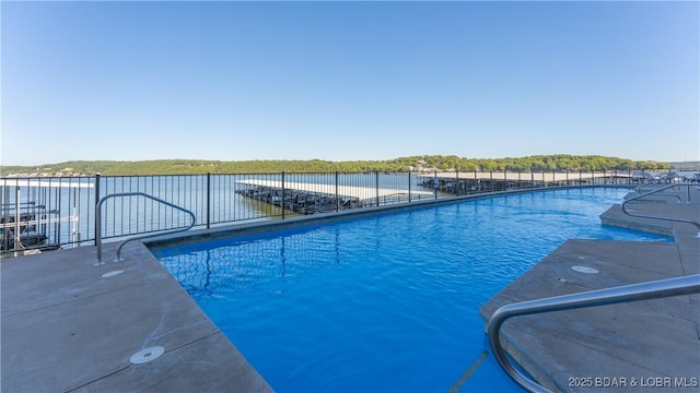 view of swimming pool featuring a fenced in pool