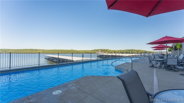 view of pool featuring fence, a fenced in pool, and a patio