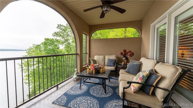 balcony with an outdoor hangout area and a ceiling fan